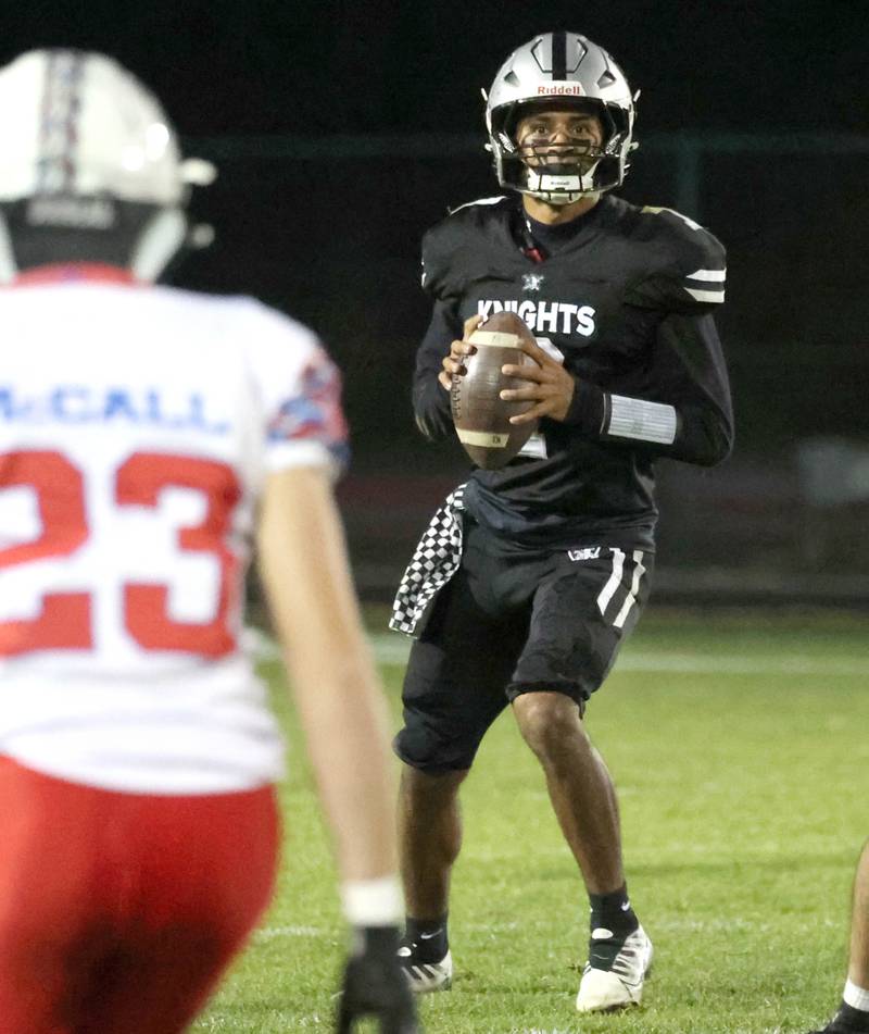 Kaneland's Jalen Carter looks for a receiver in the Lakes’ secondary Saturday, Nov. 1, 2025, during their first round playoff game at Kaneland High School in Maple Park.