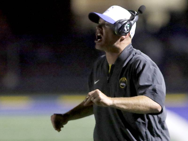 Johnsburg Head Coach Sam Lesniak yells at his team during a Kishwaukee River Conference football game against Richmond-Burton on Friday, Sept. 12, 2025, at Johnsburg High School.