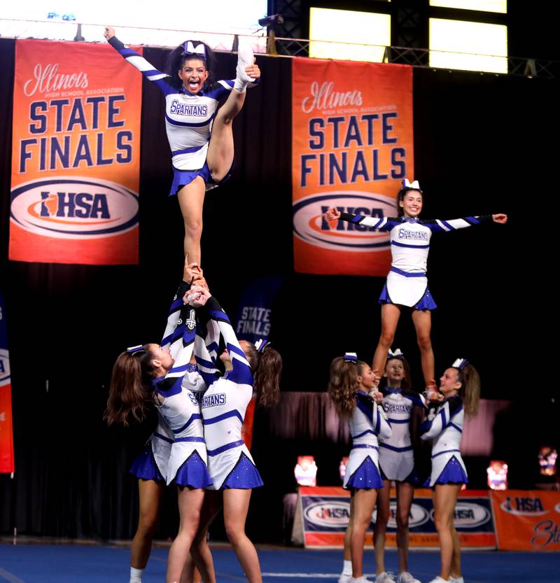 Members of the St. Francis cheerleading team compete in the small team division of the IHSA State Finals on Saturday, Feb. 8, 2025 at Grossinger Motors Arena in Bloomington.