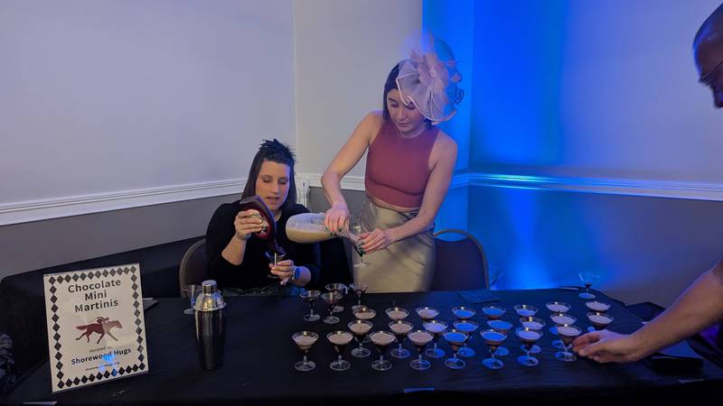 Kara Finlon of Homer Glen andColleen Coyle of Chicago, daughter of Sue Coyle one of the founders of Shorewood HUGS, set out chocolate martinis at the Shorewood HUGS chocolate ball on Saturday, February 1, 2025, in Joliet.