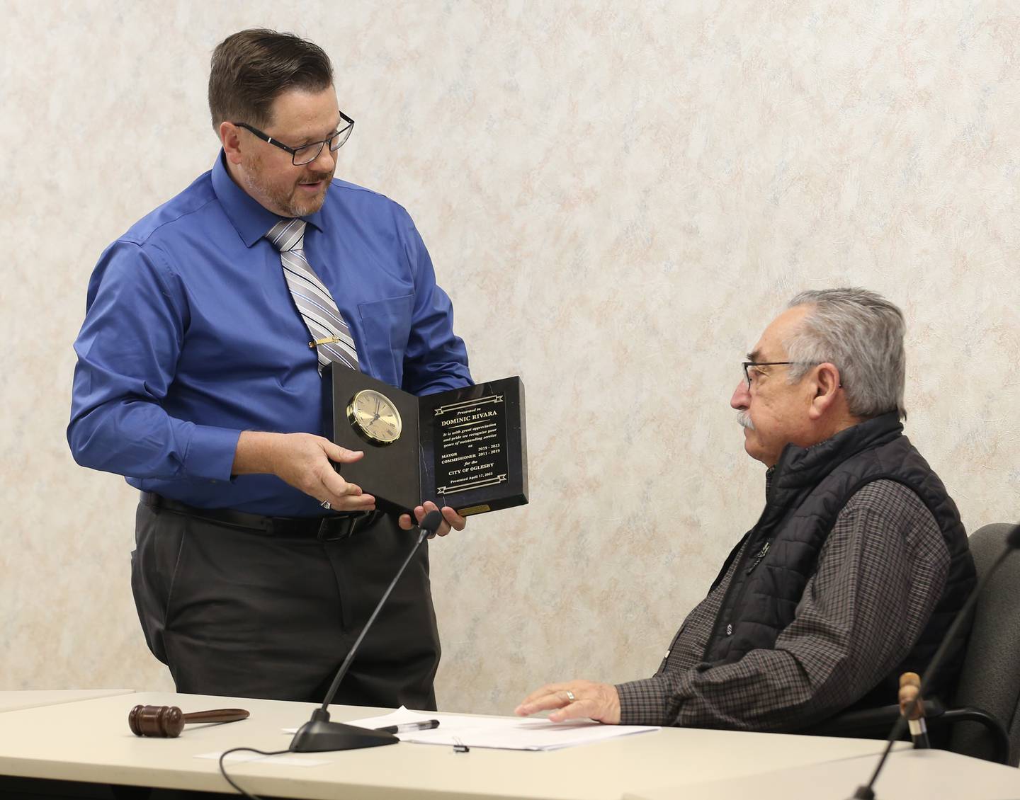 Former Oglesby mayor Dominic Rivara receives a plaque from new mayor Jason Curran on Monday May 1, 2023 at Oglesby City Hall.