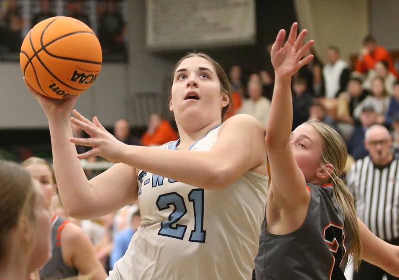 Cissna Park's Lauryn Hamrick eyes the hoop as Flanagan-Cornell/Woodland's Emma Palashak defends during the Class 1A Sectional semifinal game on Tuesday, Feb. 25, 2025 at Midland HIgh School.