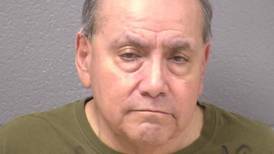 Ex-Joliet housing official charged with two felony cases will stay in jail 