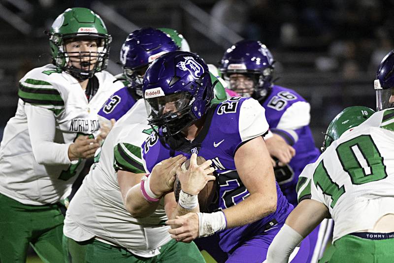 Dixon’s Aiden Wiseman picks up yards against North Boone Friday, Oct. 20, 2023 in Dixon.