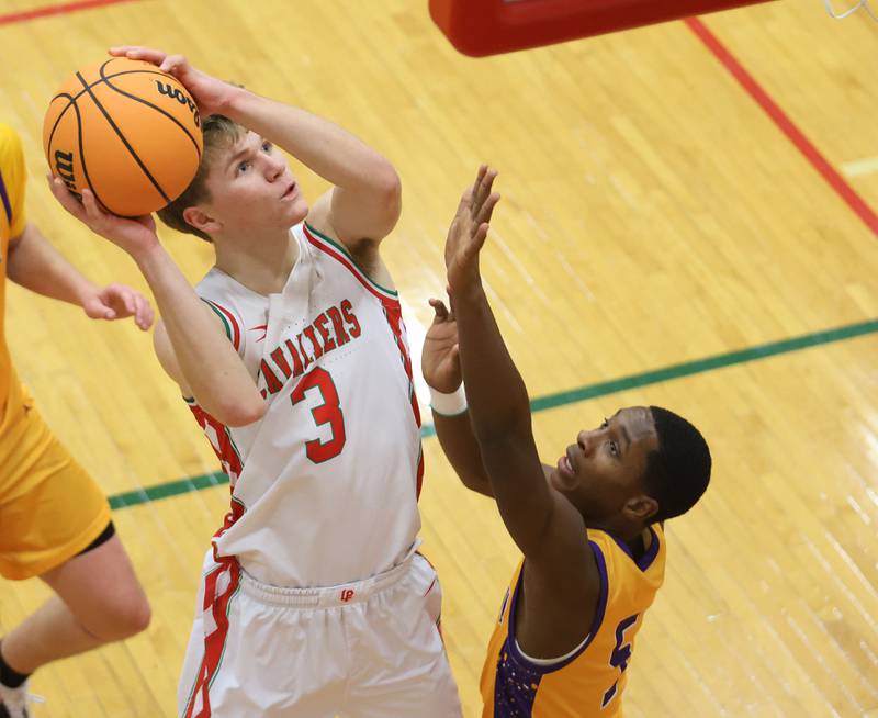 L-P's Braylin Bond eyes the hoop against Rantoul's Iysean Autman on Friday, Dec. 19, 2025 in Sellett Gymnasium at L-P High School.