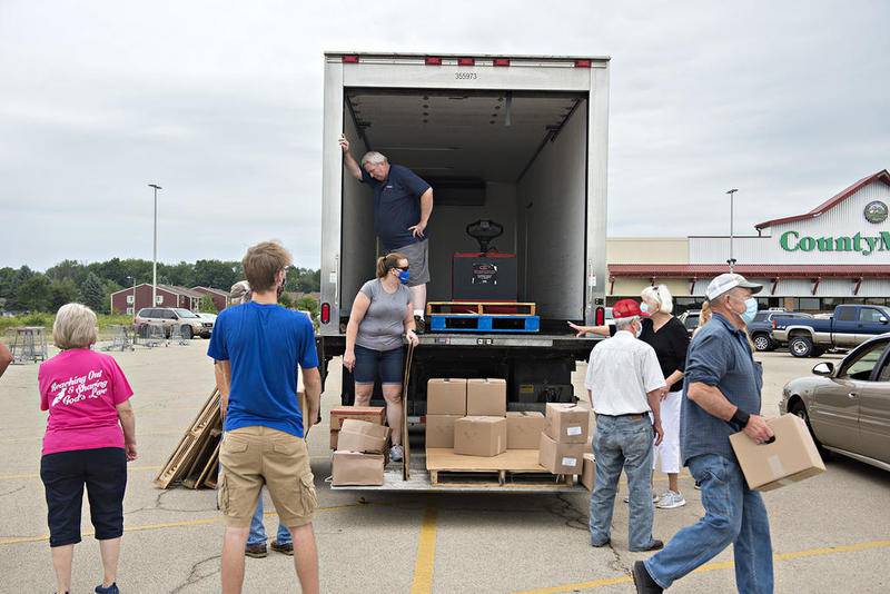 In an undated file photo, the River Bend Food Bank, St. Paul Lutheran Church and Dixon Community Food Pantry, distributes food from a mobile pantry in Dixon.  River Bend Food Bank was one of eight designed by the state to receive federal funds to expand mobile pantries in rural areas.