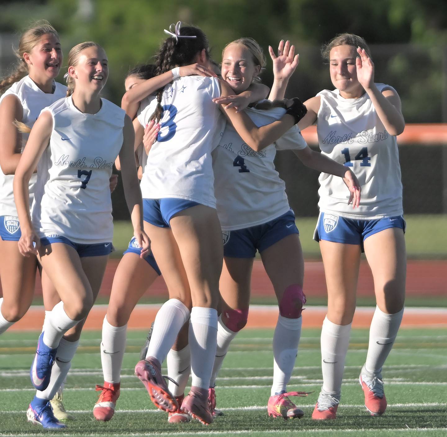 St. Charles North’s Kaitlyn Nudera is surrounded by teammates after her goal tied the score with St. Charles East in the IHSA class 3A girls soccer sectional semifinal game in St. Charles on Tuesday, May 26, 2026.