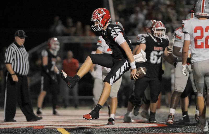 Maine South quarterback Jameson Purcell skips into the endzone for a touchdown against  Palatine in a football game in Park Ridge on Friday, Sept. 12, 2025.