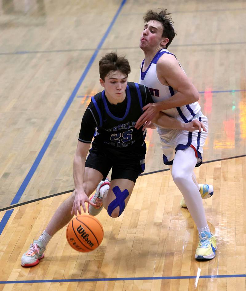 Hinckley-Big Rock’s Alex Casanas drives against Ida Crown’s Juday Well during their Class 1A sectional game Wednesday, March 5, 2025, at Somonauk High School.