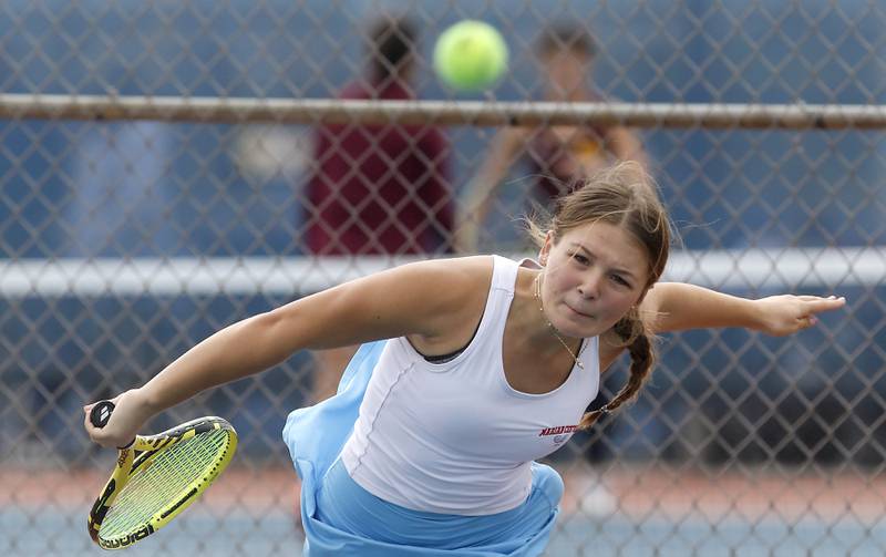 Marian Central’s Jenna Remke lathes her serve Thursday, Oct. 19, 2023, during doubles match on the first day of the IHSA State Girls Tennis Tournament at Hoffman Estates High School in Hoffman Estates.