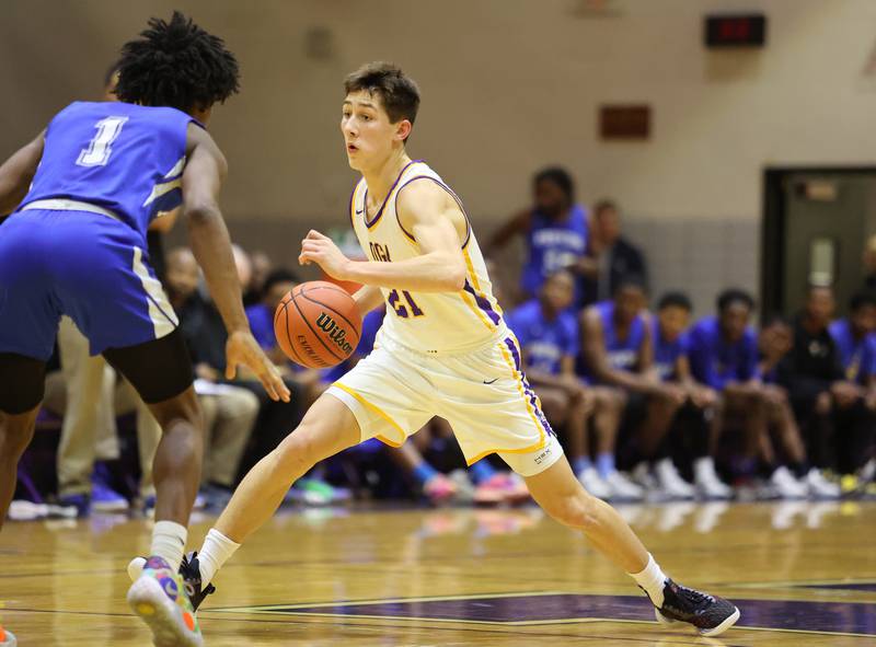 DGN's Jack Stanton (21) tries to get past the defense during the boys 4A varsity regional final between Downers Grove North and Proviso East in Downers Groves on Friday, Feb. 24, 2023.