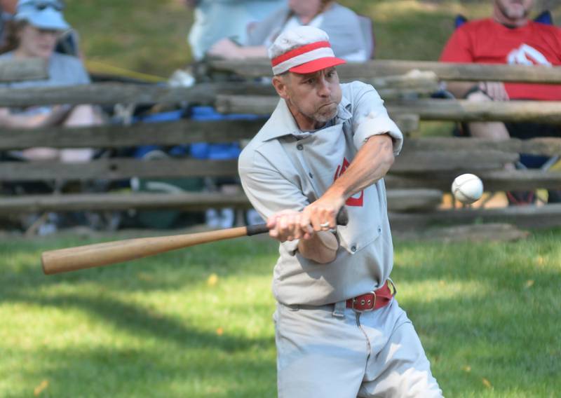 Oregon Ganymede Kevin Stafford focuses on the ball as he bats against the Columbus Buckeyes at the World Tournament of Historic Base Ball held at the Henry Ford Museum's Greenfield Village on Saturday, Aug. 9, 2025.