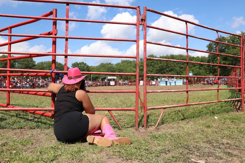 A spectator watches a competition during the 50th Pembroke Rodeo on Sunday, May 24, 2026.