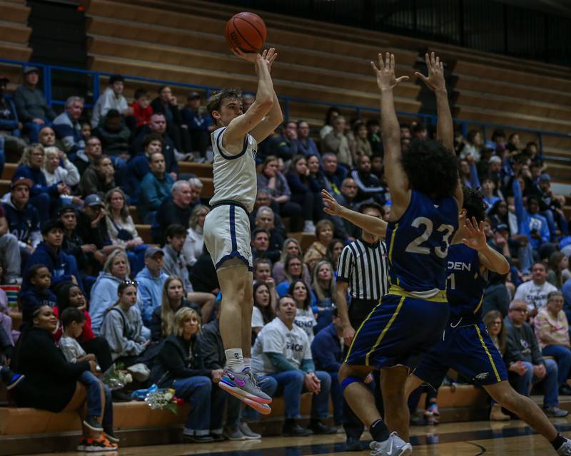 Downers Grove South's Will Potter (2) shoots a jump shot during basketball game between Leyden at Downers Grove South. Feb 9, 2024.