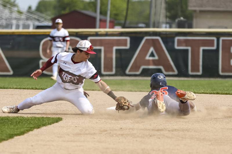 Oswego's Kam Jenkins (25) steals second base during Class 4A Plainfield North Regional final baseball game between Oswego at Plainfield North. Saturday, May 31, 2025 in Plainfield.