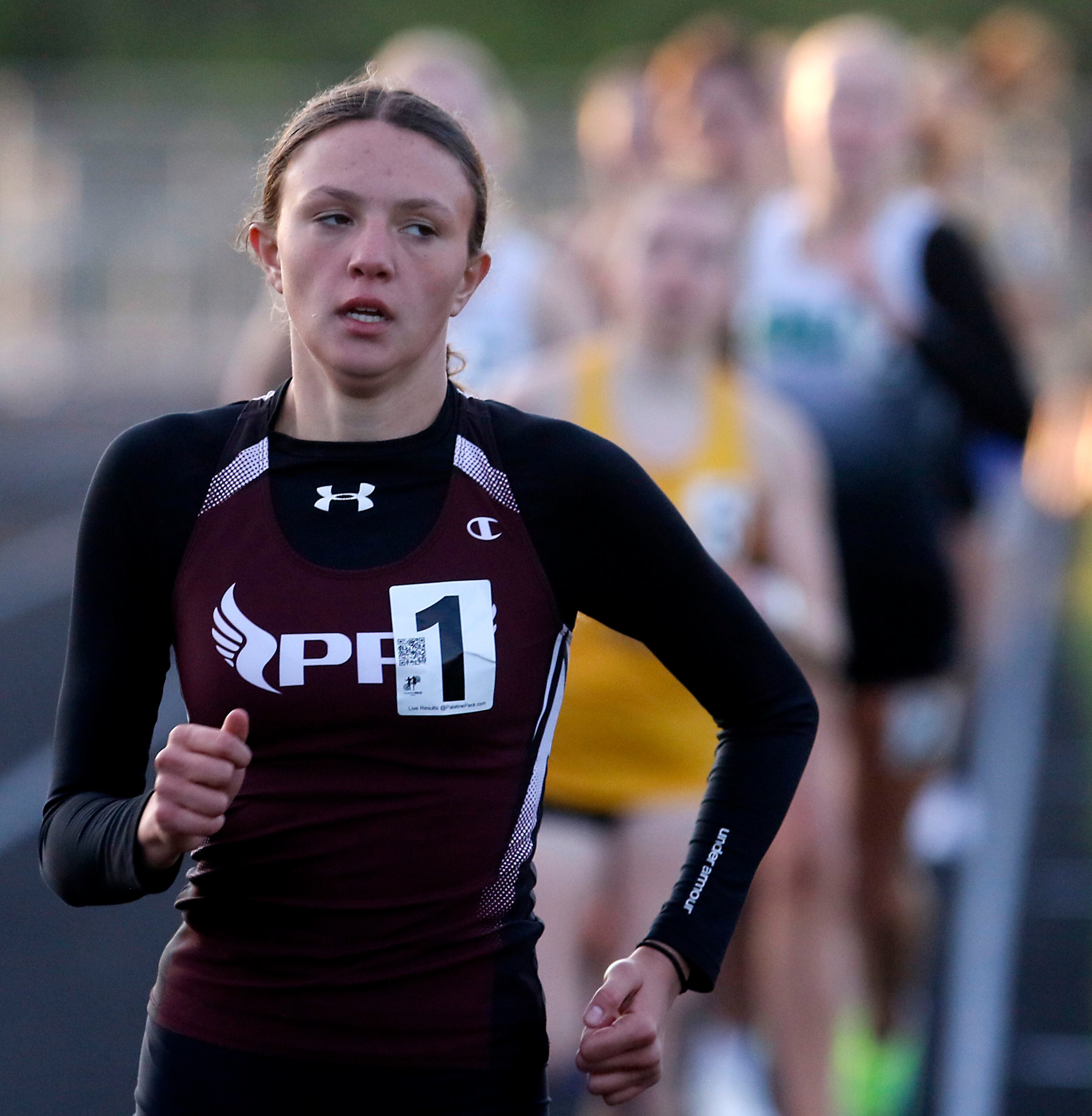 Prairie Ridge’s Lila Stewart cruses to victory in the 800 meter run on Friday, April 19, 2024, during the McHenry County Track and Field Meet at Cary-Grove High School.