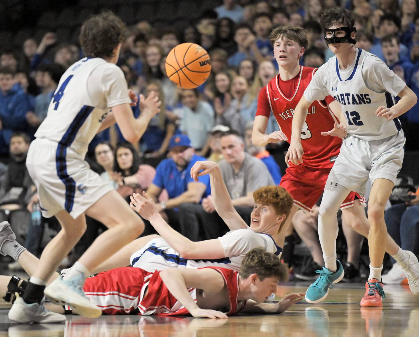 St. Francis’ Carter Clark throws the ball from the floor to teammate Johnny Shannon in the IHSA Class 3A supersectional championship game against Deerfield at the Now Arena in Hoffman Estates on Monday, Mar. 9 2026.
