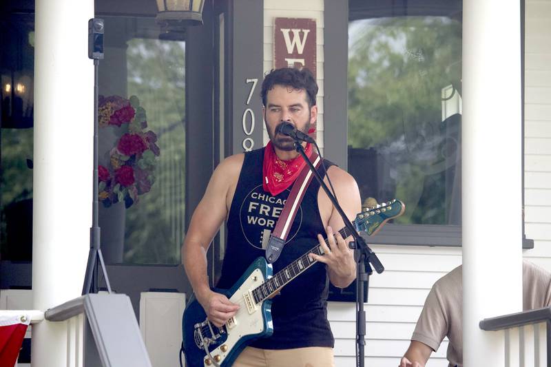 Dan Dougherty, lead guitarist and singer of the Dan Dougherty Ban,  performs in the 700 block of Western Avenue in Joliet as part of the Porch and Park Music Fest on Saturday, Aug. 16, 2025.