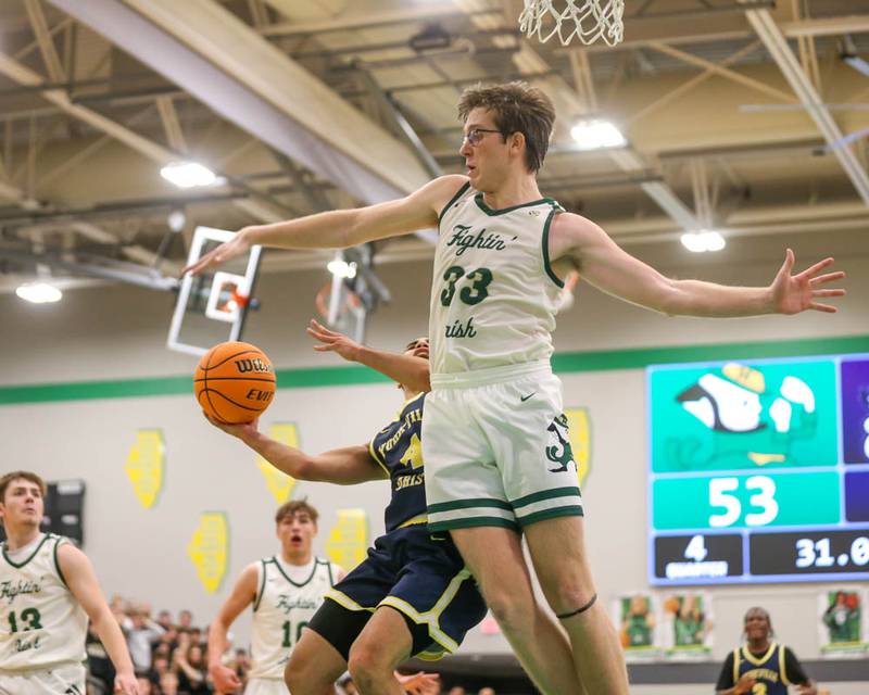 Yorkville Christian's Tray Alford (4) draws a foul from Bishop Mcnamara's Callaghan O'Connor (33) during their Class 2A Seneca Sectional final basketball game between Bishop McNamara at Yorkville Christian, March 6, 2026 in Senaca.