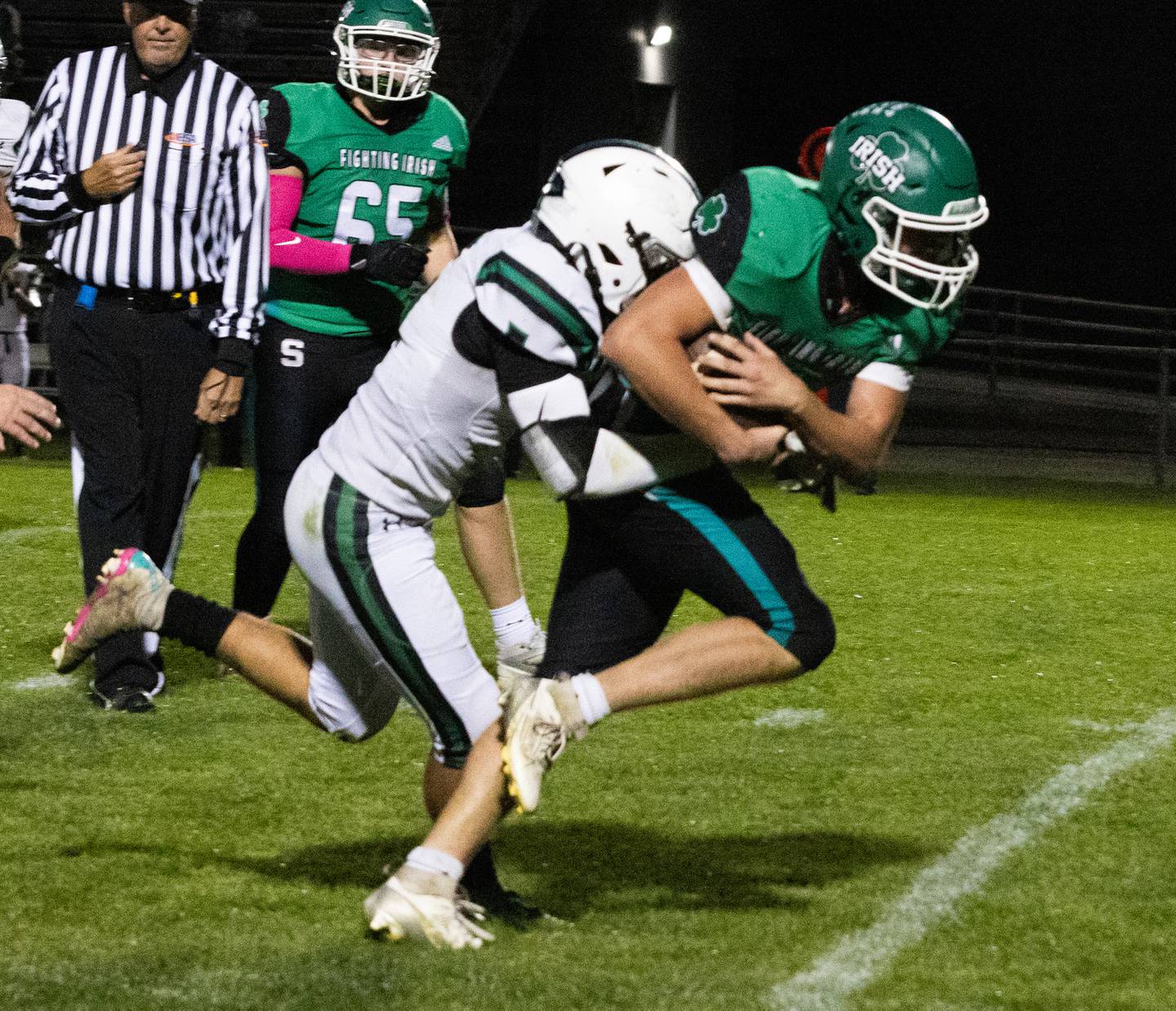 Seneca ballcarrier Nick Grant tries to break a Dwight/Gardner-South Wilmington tackle Friday, Oct. 4, 2024, in Seneca.