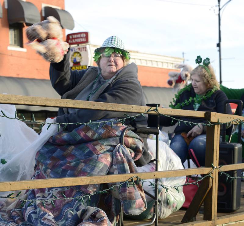 Besides candy treats , some floats tossed stuffed animals to the crowd along Main St in Marseilles Saturday during the annual St Patrick's Day Parade.