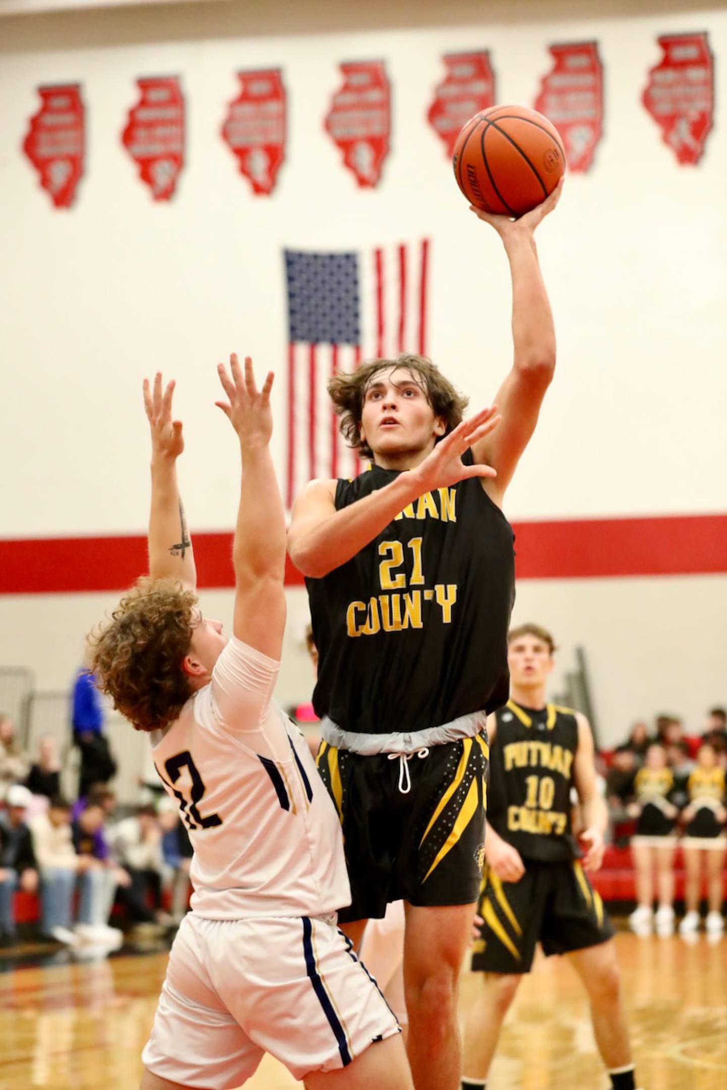 PC's Orlando Harris shoots over Marquette Saturday night at Hall High School.