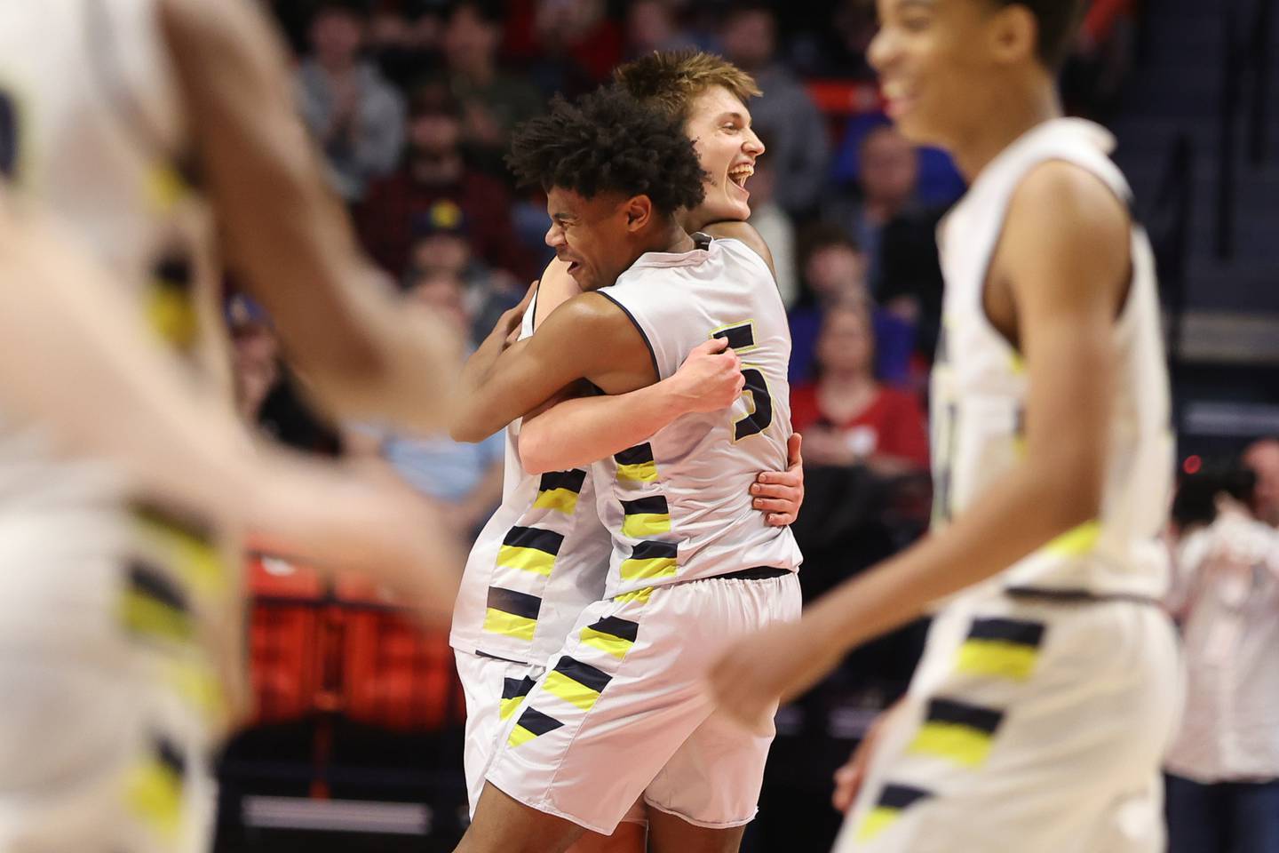 Yorkville Christian’s Jaden Schutt (2) and Tyler Burrows (5) embrace after their 54-41 win over Liberty in the Class 1A championship game at State Farm Center in Champaign. Friday, Mar. 11, 2022, in Champaign.