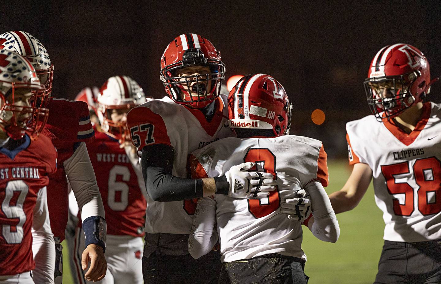 Amboy’s Trey Payne (left) celebrates Tucker Lindenmeyer’s touchdown Friday, Nov. 18, 2022 in the 8-man championship football game against West Central.