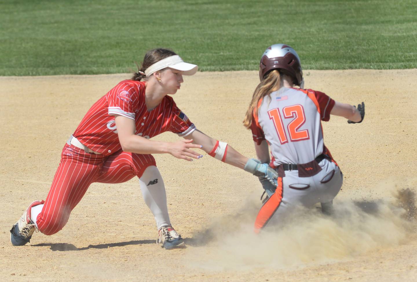 Oregon's Ella Dannhorn tags Warren-Stockton's Emma Janecke as she successfully steals second base on Saturday, May 10, 2025 at Oregon Park West.