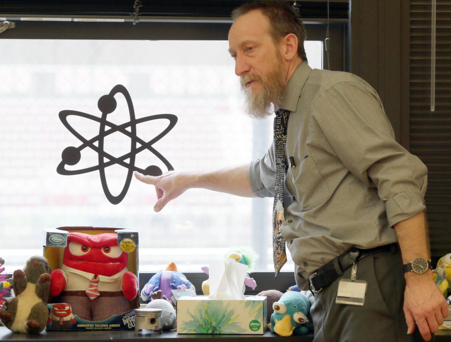 Bryan Leonard, chemistry teacher at Ottawa Township High School, points to an atom in his classroom on Tuesday March 29, 2022 in Ottawa. Leonard, has been teaching for 28 years and has seen changes in technology and how kids process information and he has tried to keep up with it.