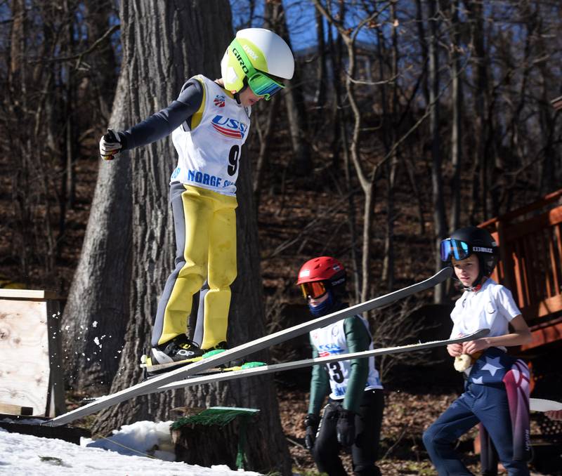 Norge’s Benjamin McWilliams jumps during the U8 small hills competition during opening day of the Norge Ski Club’s 118th annual Winter Ski Jump Tournament Saturday.