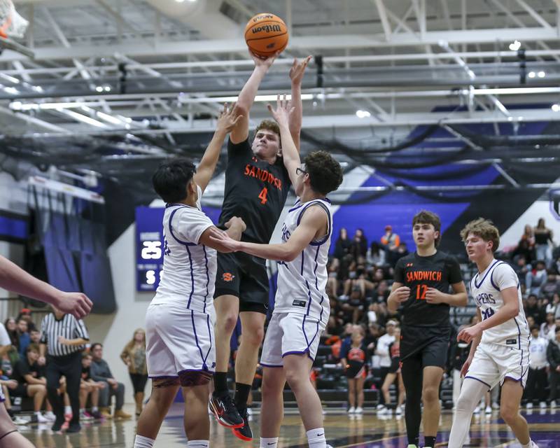 Sandwich's Griffin Somlock (4) shoots a fade a way from the top of the key during their basketball game between Sandwich at Plano Tuesday, Dec 9, 2025 in Plano.