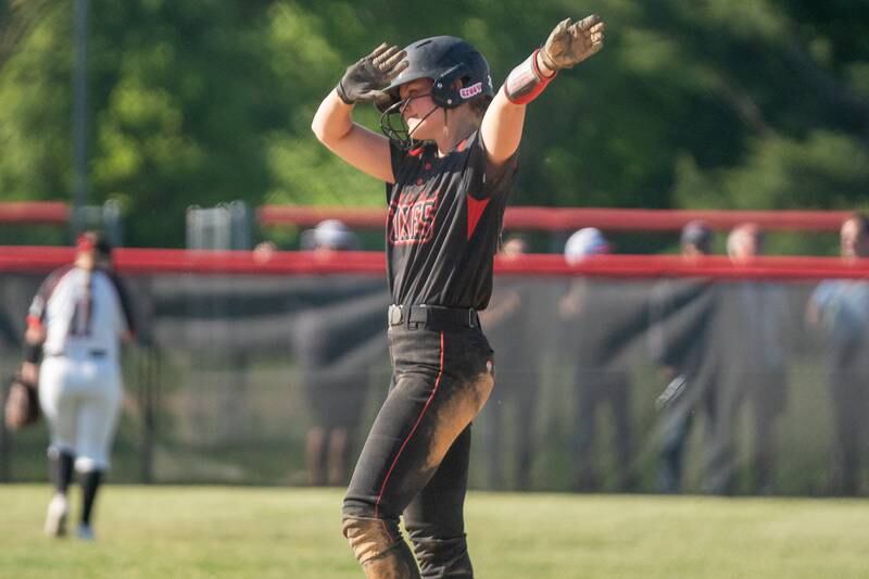 Yorkville's Katlyn Schraeder (12) celebrates after hitting a two run double against Plainfield North during the Class 4A Yorkville Regional softball final at Yorkville High School on Friday, May 26, 2023.