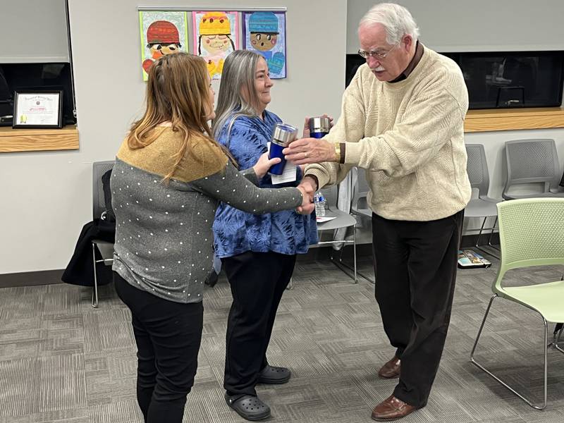Ken Miller, President of the Coal City Community Unit School District 1 Board of Education, commended early childhood educators Angie Phillips and Tricia Togliatti on completing the maintenance of certification process through the National Board of Professional Teaching Standards.