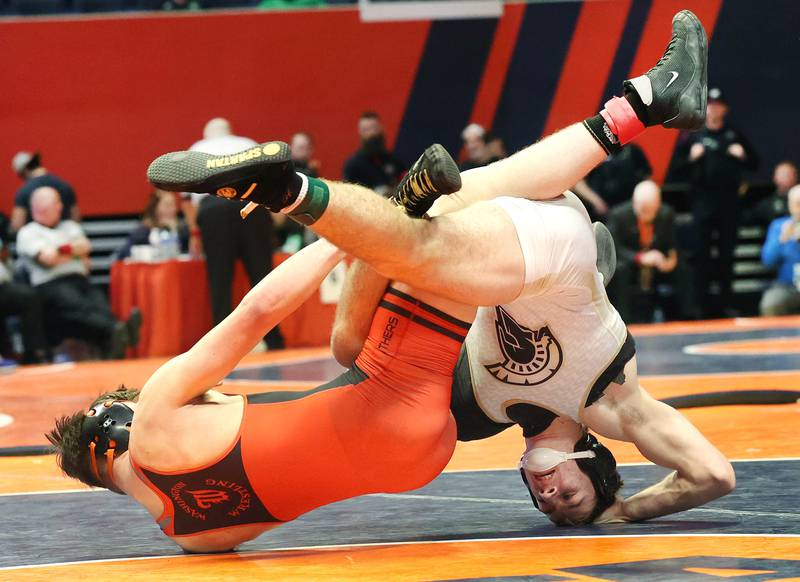 Sycamore’s Zack Crawford (right) and Washington’s Zane Hulet take a tumble in the Class 2A 160 pound 3rd place match Saturday, Feb. 18, 2023, in the IHSA individual state wrestling finals in the State Farm Center at the University of Illinois in Champaign.