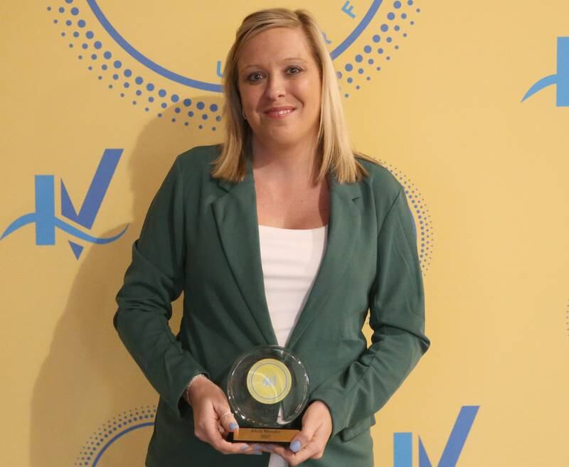 Alicia Meseke poses for a photo with her award during the 40 Under Forty awards banquet on Thursday, March 21, 2024 at Westclox in Peru.