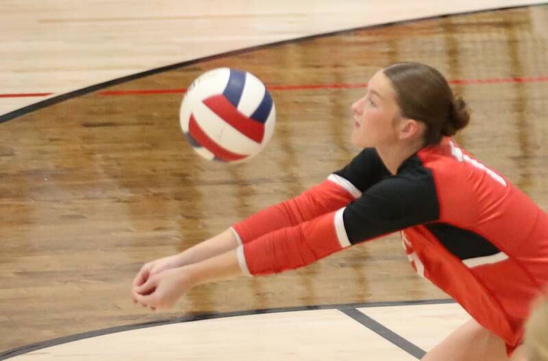 Earlville's Bailey Miller returns a serve from Woodland on Wednesday, Sept. 25, 2024 at Woodland High School.