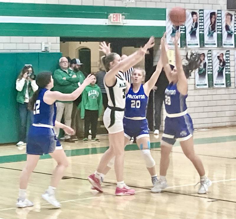 Princeton's Reese Reviglio (20) and Miyah Fox (23) double up on Alleman's Clair Hulkein the first half of Thursday' Class 2A regional finals in Rock Island.