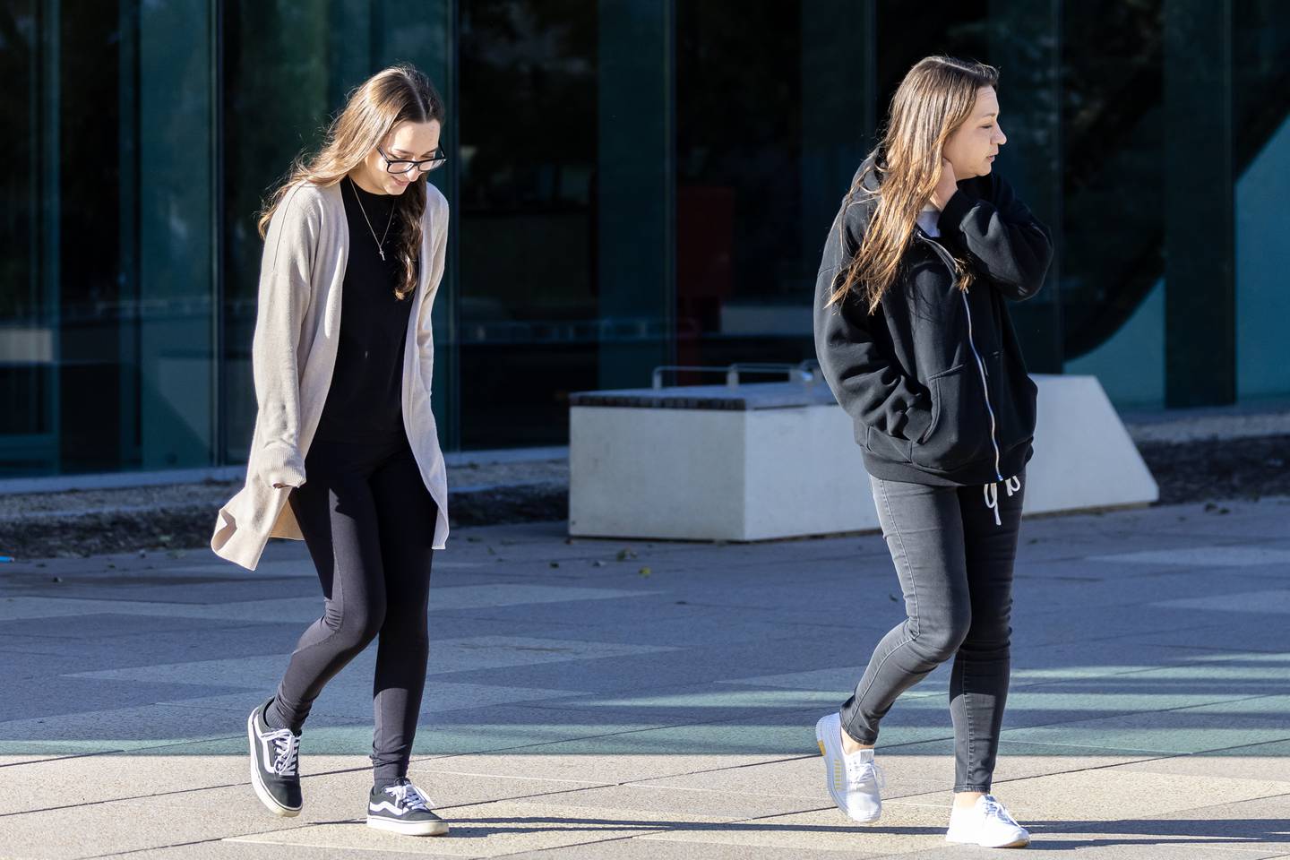 Ryane Burgett-Masse, 20, (left) and Amy Burgett-Masse, 45, both of Elwood, exit the Will County Courthouse in Joliet on Oct. 29, 2025.