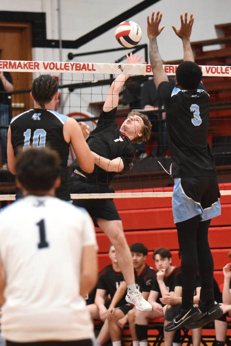Bradley-Bourbonnais' Trent Evans looks to place a hit between the Kankakee defense during a game at Bradley-Bourbonnais Thursday, April 9, 2026.