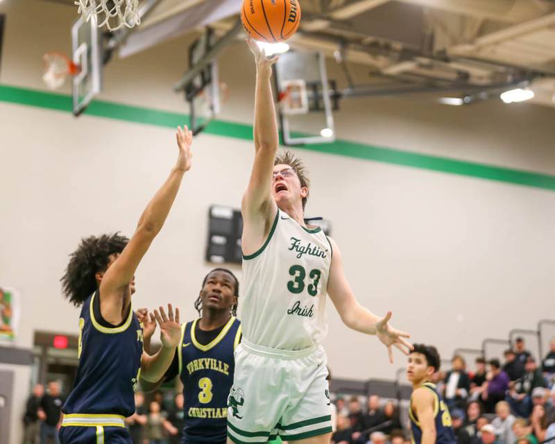 Bishop Mcnamara's Callaghan O'Connor (33) puts in a late basket during their Class 2A Seneca Sectional final basketball game between Bishop McNamara at Yorkville Christian, March 6, 2026 in Senaca.