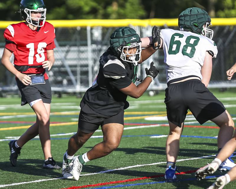 Jayden Daniel chases down the ball at Glenbard West football practice, Wednesday, Aug 21, 2025  in Glen Ellyn.