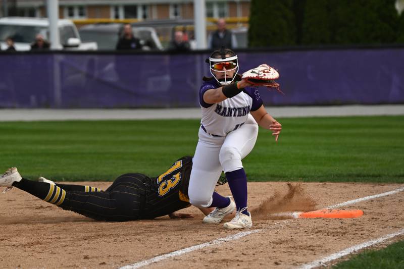 Manteno's Macy Iwanus makes the catch at first as Herscher's Chloe Kinkade dives back during the Panthers' 4-1 victory on Monday, May 5, 2025.
