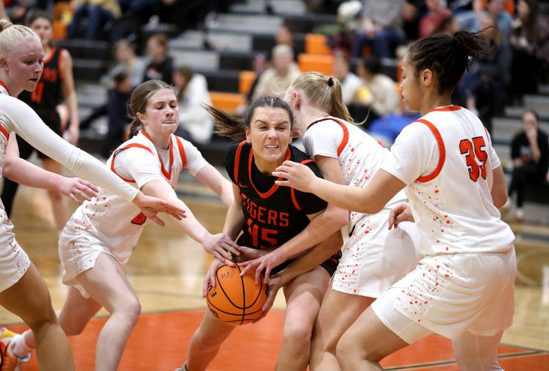 Wheaton Warrenville South's Marley Carbonaro tries to get through the St. Charles East defense during a game on Tuesday, Feb. 11, 2025 in St. Charles.