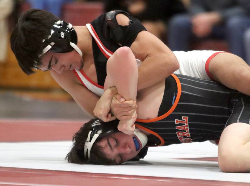 Huntley’s Alex Gutierrez, top, battles Crystal Lake Central’s Daniel Snow at 132 pounds in varsity wrestling on Friday, Dec. 13, 2024 at Huntley High School in Huntley.