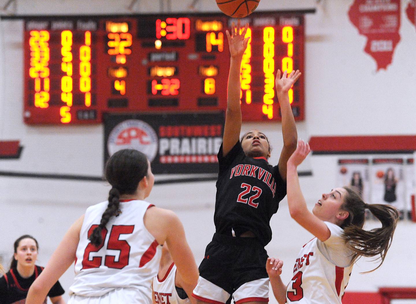 Yorkville's Alex Stewart (22) takes a jumper over Benet defender Magdalena Sularski during the Girls' Class 4A Regional Final at Yorkville High School on Thursday, Feb. 16, 2023.