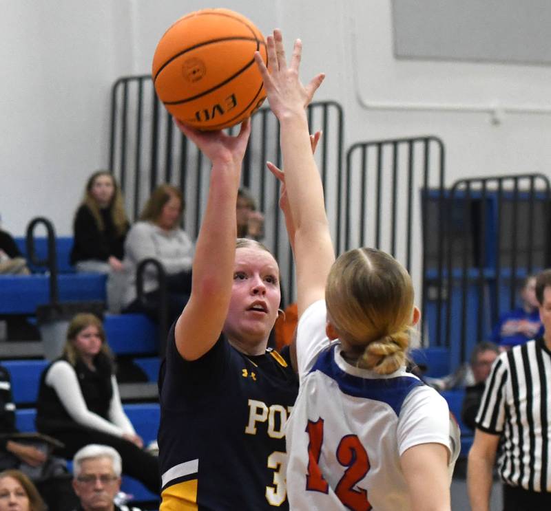 Polo's Carlee Grobe shoots as Eastland's Celeste Lower tries to get a piece of the ball on Tuesday, Feb. 10, 2026 at Eastland High School in Lanark.