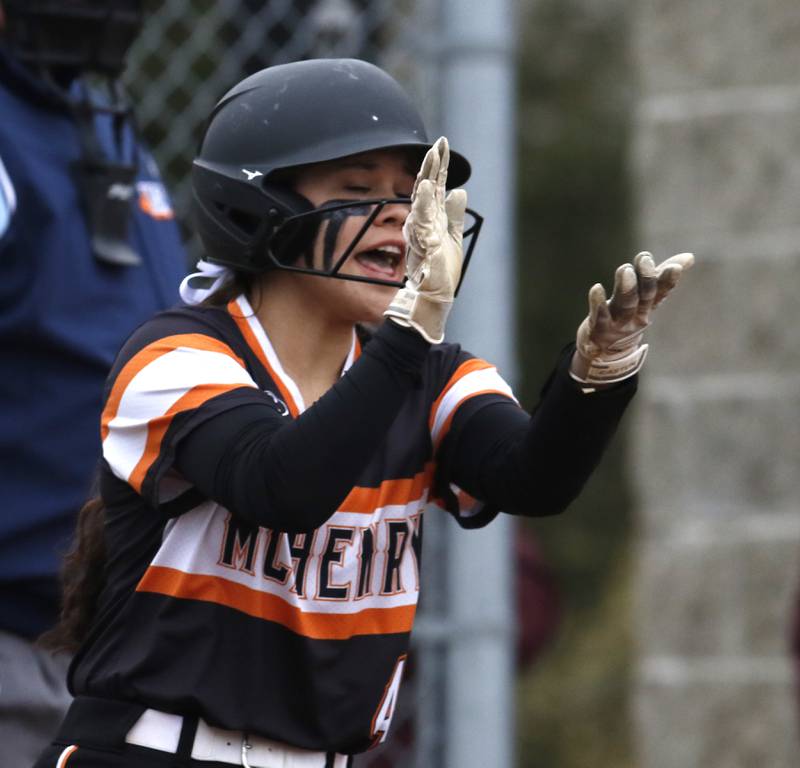 McHenry's Abby Geis claps after scoring a run during a non-conference softball game Tuesday March 22, 2022, between Richmond-Burton and McHenry at Richmond-Burton High School.