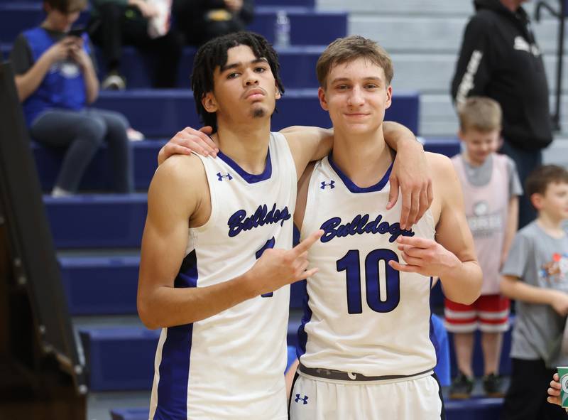 Riverside Brookfield's William Gonzalez and Arius Alijsius (10) celebrate their win after the boys varsity basketball game between IC Catholic Prep and Riverside Brookfield in Riverside on Tuesday, Jan. 24, 2023.