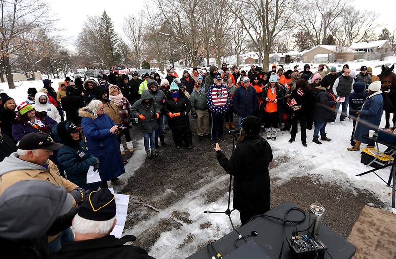 Susan Yon Hanson, President of McHenry American Legion Auxiliary, speaks to the crowd during McHenry's Wreath Laying Ceremony in honor of fallen veterans on Friday, Dec. 5, 2025, at St. Mary's Catholic Cemetery in McHenry. The event was hosted by McHenry American Legion Post 491 and Team Home Depot.